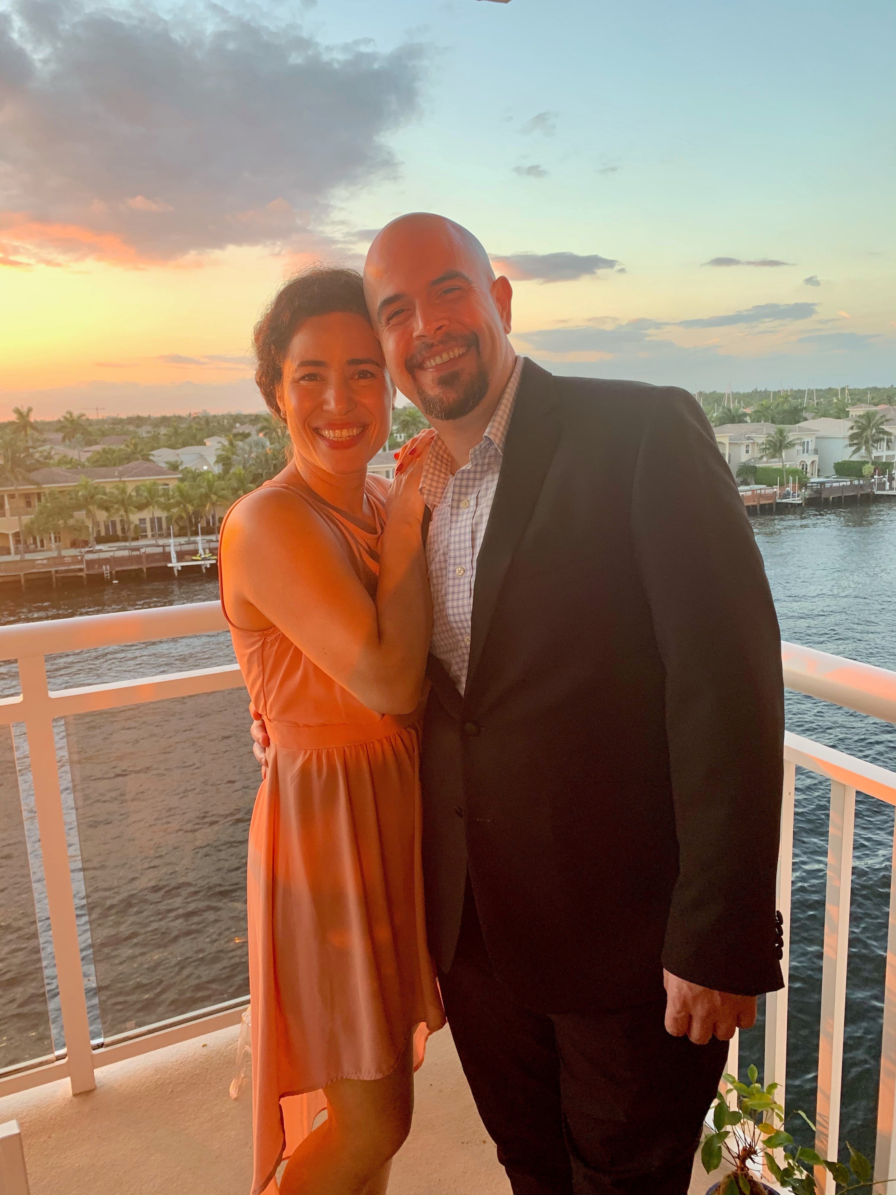 Inti and wife Angela posing in front of the sun setting